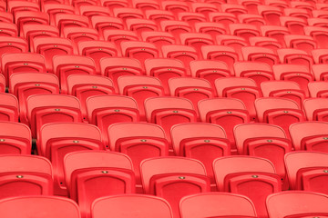 sport stadium chair. empty red concert chair. plastic red seats