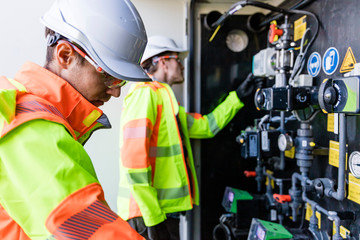 Engineers checking  measuring devices