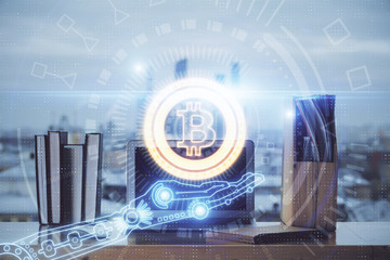 Multi exposure of blockchain theme hologram and table with computer background. Concept of bitcoin...