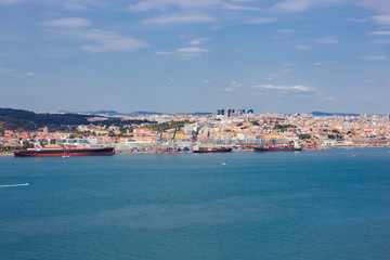 Fototapeta na wymiar Lisbon on the Tagus river bank, central Portugal. Tajo view from the ferry to Almada.