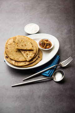 Sattu Ka Paratha / Stuffed Channa Dal Flour Paratha served with mango pickle and curd or dahi