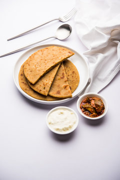 Sattu Ka Paratha / Stuffed Channa Dal Flour Paratha served with mango pickle and curd or dahi