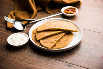 Sattu Ka Paratha / Stuffed Channa Dal Flour Paratha served with mango pickle and curd or dahi