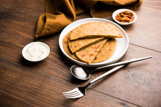 Sattu Ka Paratha / Stuffed Channa Dal Flour Paratha served with mango pickle and curd or dahi
