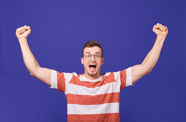 Fototapeta premium The fan rejoices in the victory of the team.