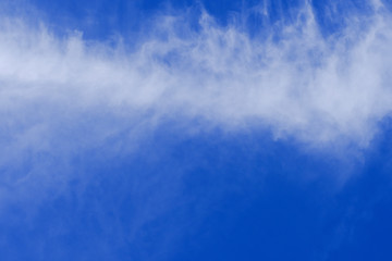 Fototapeta na wymiar Beautiful blue sky with white gorgeous fluffy cloudy flowing with the wind