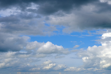 Fototapeta premium Beautiful blue sky with white gorgeous and dark fluffy cloudy flowing with the wind