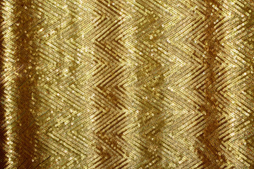 Obraz premium Beautiful golden glitter background with golden sequins. Sparkling sequined textile