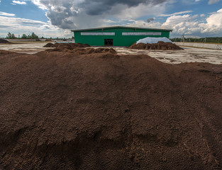 peat processing plant, warehouse of raw materials and finished products