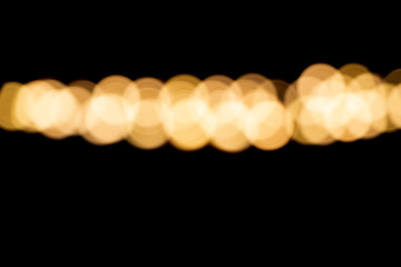 Defocused of photo bokeh blurred circle light from colorful neon lighting bulb in the night for abstract background texture pattern