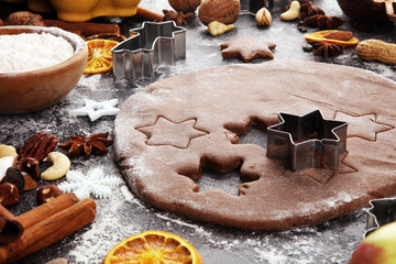 Baking christmas cookies. Typical cinnamon stars bakery with spices. xmas decoration on table