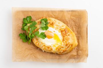 Adjarian khachapuri with egg yolk and cheese isolated on white background