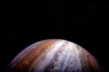 The planet Jupiter, on a dark background with place for text. Elements of this image furnished by NASA