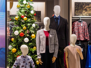 SINGAPORE - 17 NOV 2019 - A Christmas family fashion window display at a Marks & Spencer store
