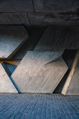 Architectural interior background concrete wall made of geometric shapes
