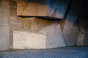 Architectural interior background concrete wall made of geometric shapes