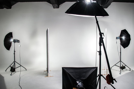The interior of the photo studio. Preparing to work with photographic equipment. Cyclorama, background, exposure to light on the octobox, softbox.