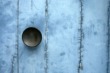 door handle on wooden peeling paint