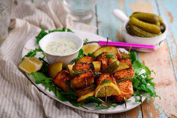 grilled Salmon kebab with green salad .style rustic