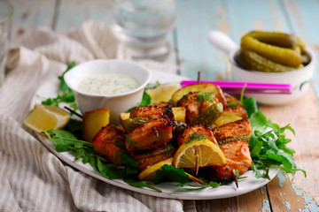 grilled Salmon kebab with green salad .style rustic