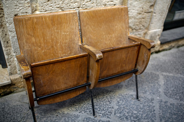 wooden chairs from the cinema on the street