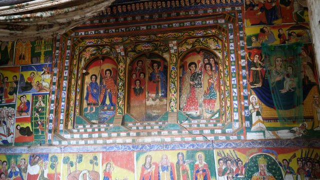 Dolly in to colorful monastery church painting in Gondar, Ethiopia