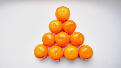 triangle tangerines isolated on white background