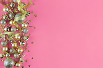 Christmas background with Xmas toys on pink canvas background. Happy New Year. Copy space.