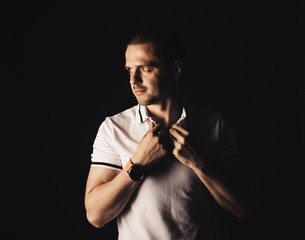 Adult man in white t-shirt looking away