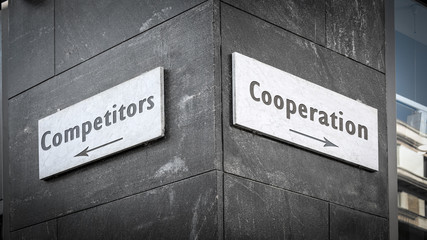 Street Sign Cooperation versus Competitors