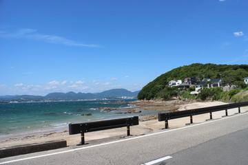A road next to the ocean in Shirahama, Japan