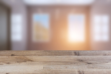 Empty interior with large window. Retro light bulb. The floor is of brown parquet.  3D rendering. wooden table. blurred background