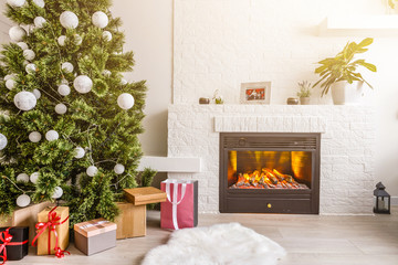 Fototapeta premium Merry Christmas and Happy Holidays! A beautiful living room decorated for Christmas.