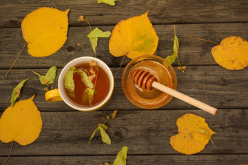 Linden flowers isolated on wood background.