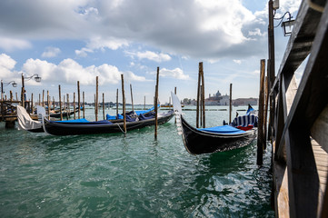 Gondolas in Venice with San Giorgio Maggiore church from San Marco square. Italy