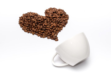Coffee beans arrange in heart shaped with white cup on white background
