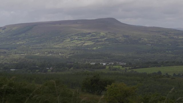 A landscape pan shot including mountains and lakes in Ireland