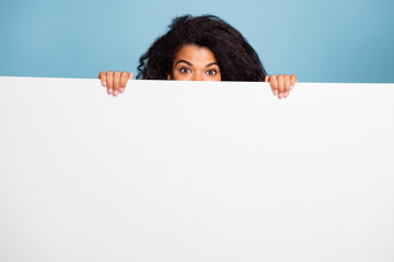 Photo of curly wavy cute cheerful positive brown haired presenting you information on white banner...