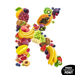 Letter K made of berries and fruits, food font isolated on white background