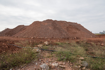 Close-up landscape view of towering stacked sand in large quarry