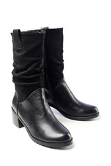 women's black demi-season leather boots on white background