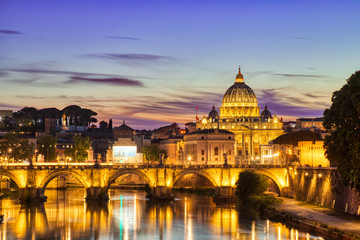 Fototapeta na wymiar Illuminated St. Peter's Cathedral in Rome at Dusk