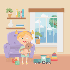 smiling little girl with toys in the living room