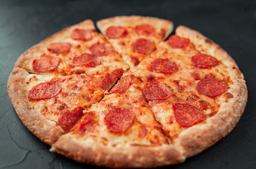 Pepperoni pizza on stone background, ready to eat
