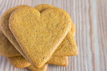 Top view of stack of gingerbread cookies on wooden table in horizontal with copy space