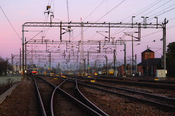 Fototapeta na wymiar Kouvola, Finland - 15 November 2019: Railway yard at beautiful sunset background.
