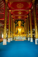Fototapeta premium Buddha statute in prayer hall at Wat Jed Yod, Chiang Rai, Thailand