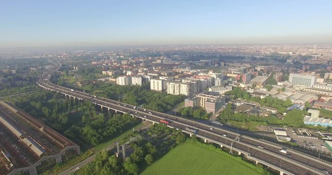 Milan, Italy. Outskirts of the city from the eastern side of the motorway, with the skyline in the distance.