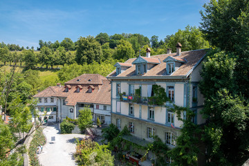 Fototapeta na wymiar The Swiss houses in the greens, Switzerland, Bern