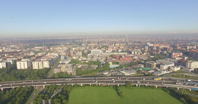 Milan, Italy. Outskirts of the city from the eastern side of the motorway, with the skyline in the distance.